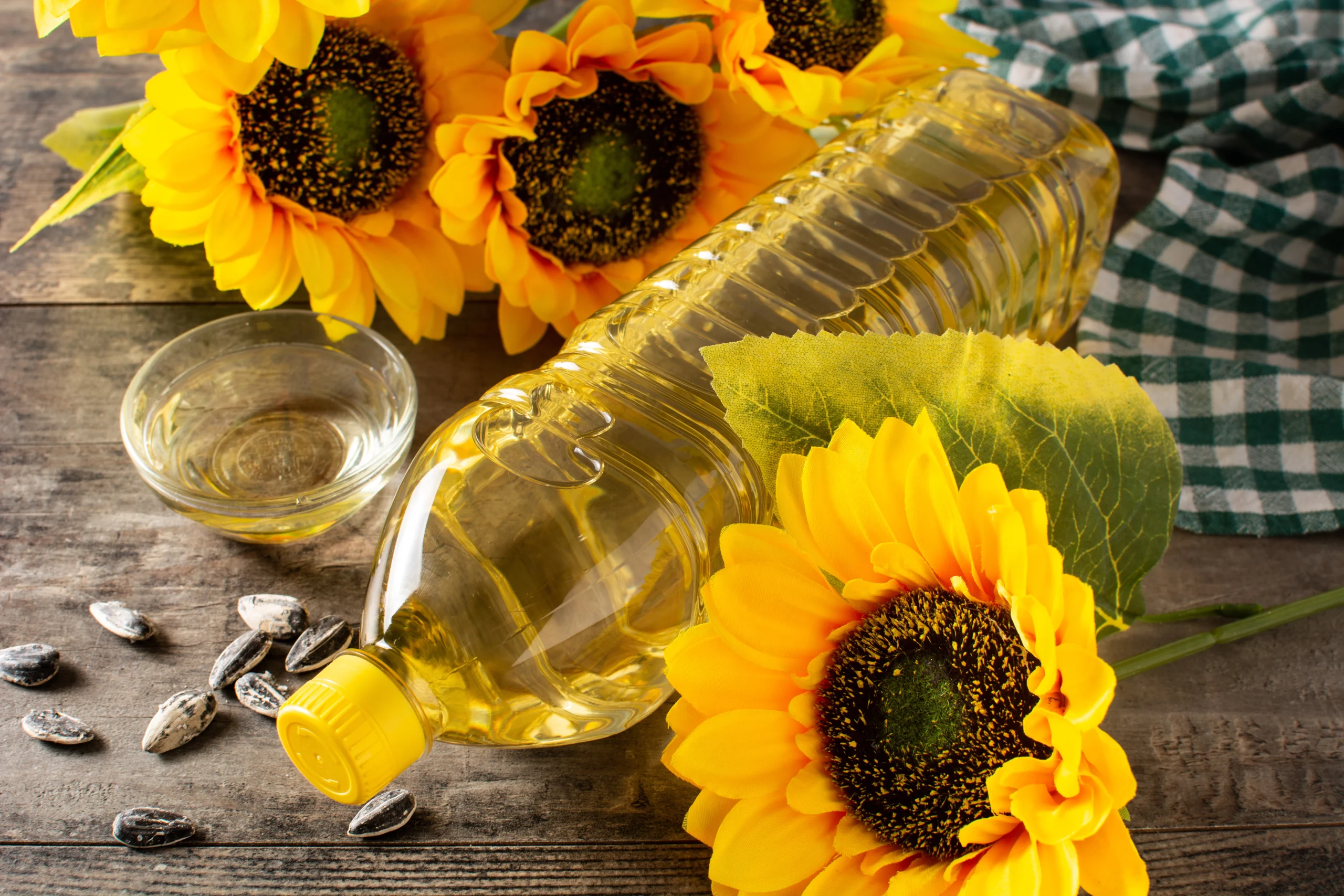 Sunflower oil plastic bottle wooden table